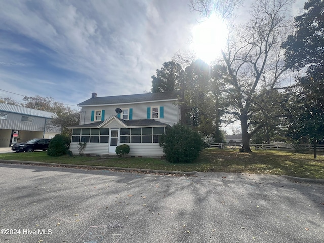 front of property with a sunroom