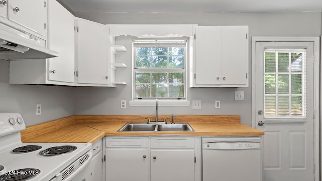 kitchen with white cabinetry, sink, and white appliances