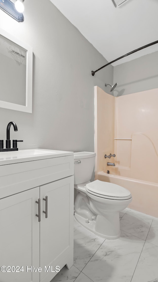 full bathroom featuring vanity, shower / washtub combination, and toilet