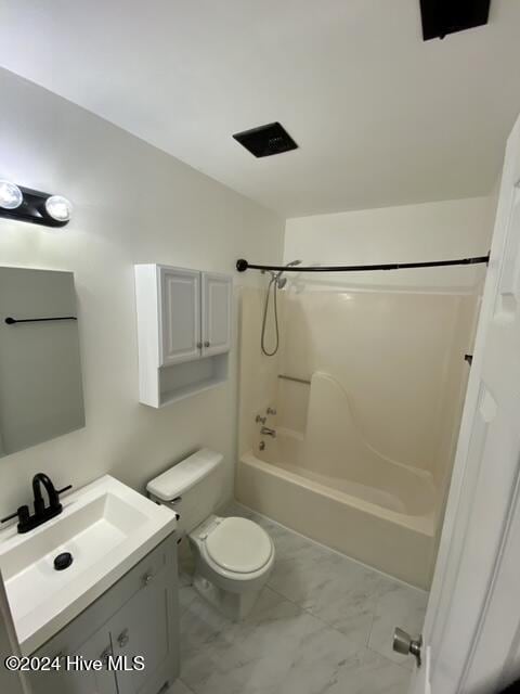 full bathroom with toilet, vanity, and shower / bath combination