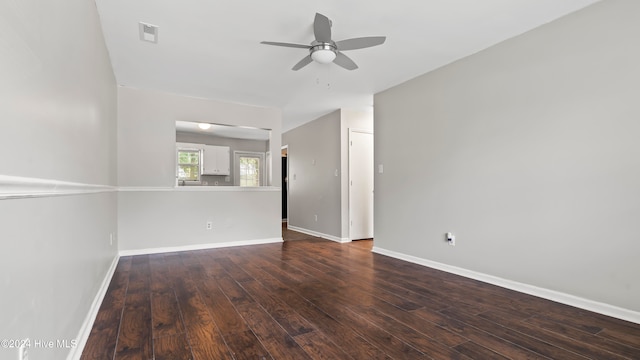 unfurnished room featuring dark hardwood / wood-style flooring and ceiling fan