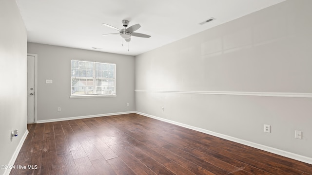 unfurnished room featuring dark hardwood / wood-style flooring and ceiling fan