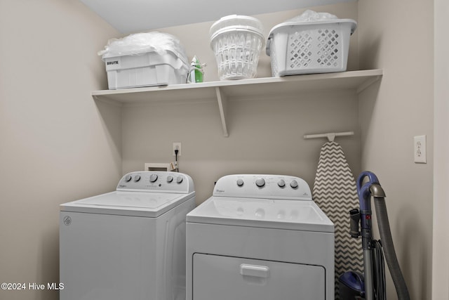 washroom featuring washing machine and dryer