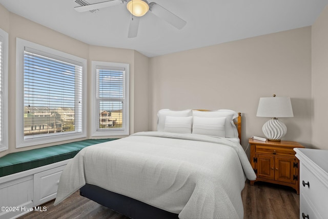 bedroom with dark wood-type flooring and ceiling fan