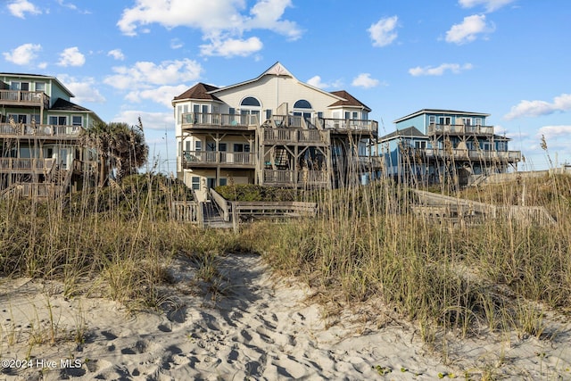 back of house with a wooden deck