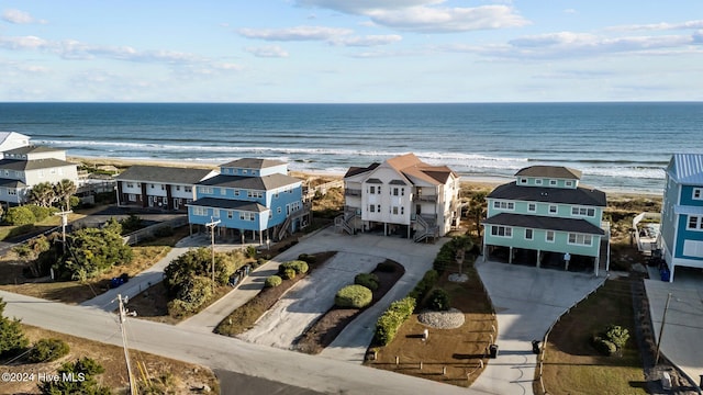 aerial view with a view of the beach and a water view