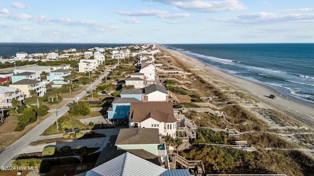 bird's eye view featuring a view of the beach and a water view