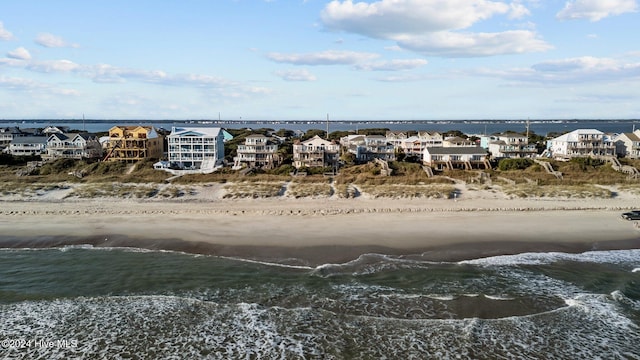 aerial view with a water view and a view of the beach