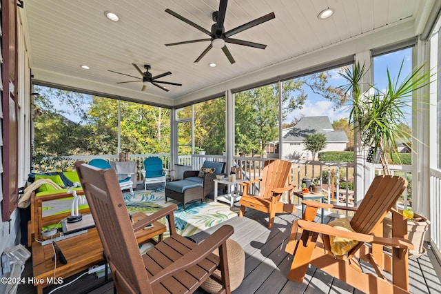 sunroom / solarium with wooden ceiling and ceiling fan