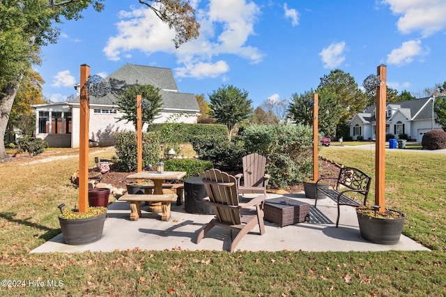 view of patio featuring an outdoor fire pit