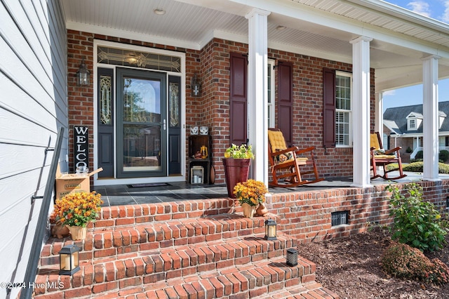 property entrance featuring covered porch