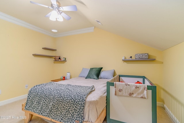 carpeted bedroom featuring ceiling fan and ornamental molding