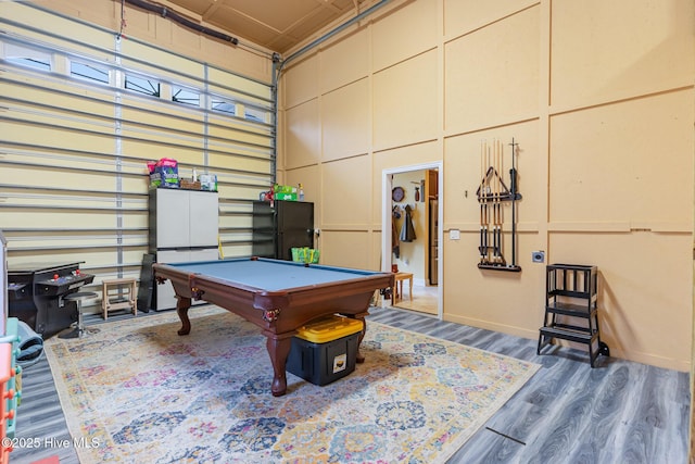 game room featuring dark hardwood / wood-style flooring and billiards