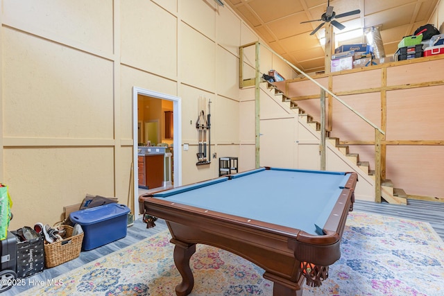 rec room featuring ceiling fan, billiards, and light hardwood / wood-style flooring