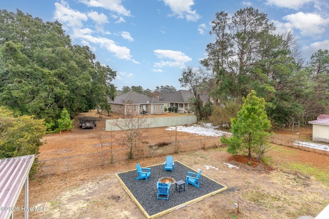 view of yard with a fire pit