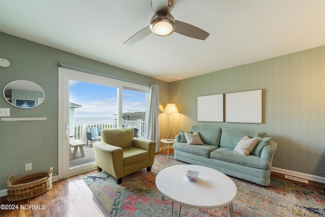 living room with hardwood / wood-style floors and ceiling fan