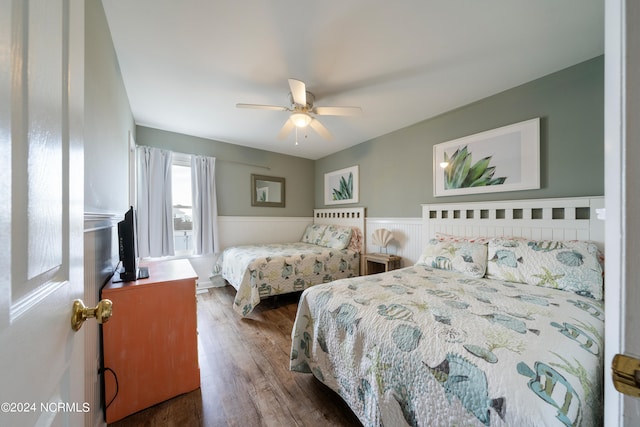 bedroom featuring dark wood-type flooring and ceiling fan