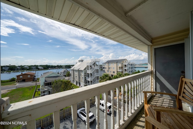 balcony featuring a water view