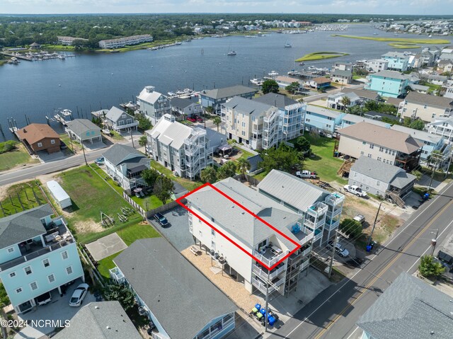 birds eye view of property with a water view