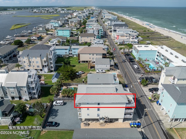 bird's eye view with a beach view and a water view