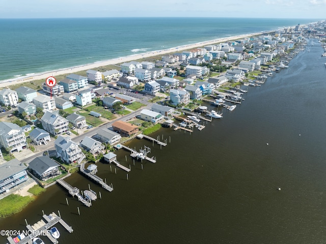 aerial view featuring a water view and a beach view