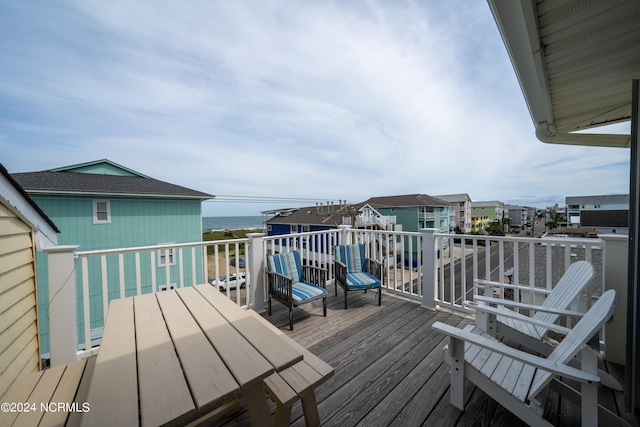 wooden terrace with a water view