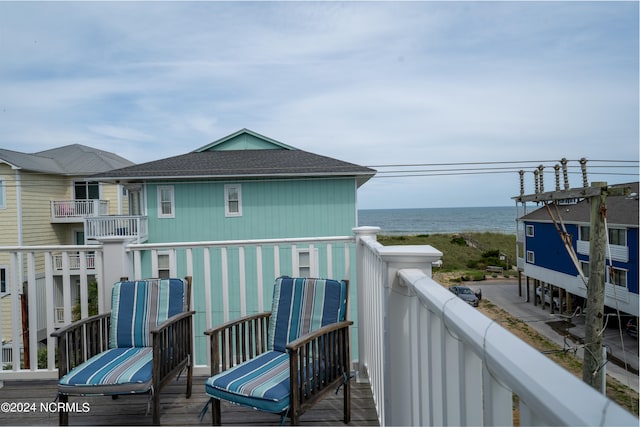 balcony featuring a water view