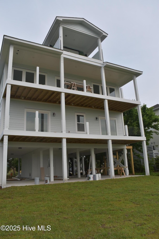 109 Old Village Ln, North Topsail Beach, NC 28460 - rear view of property featuring a yard and board and batten siding