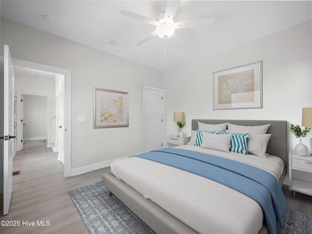 bedroom with ceiling fan, light wood-type flooring, and baseboards