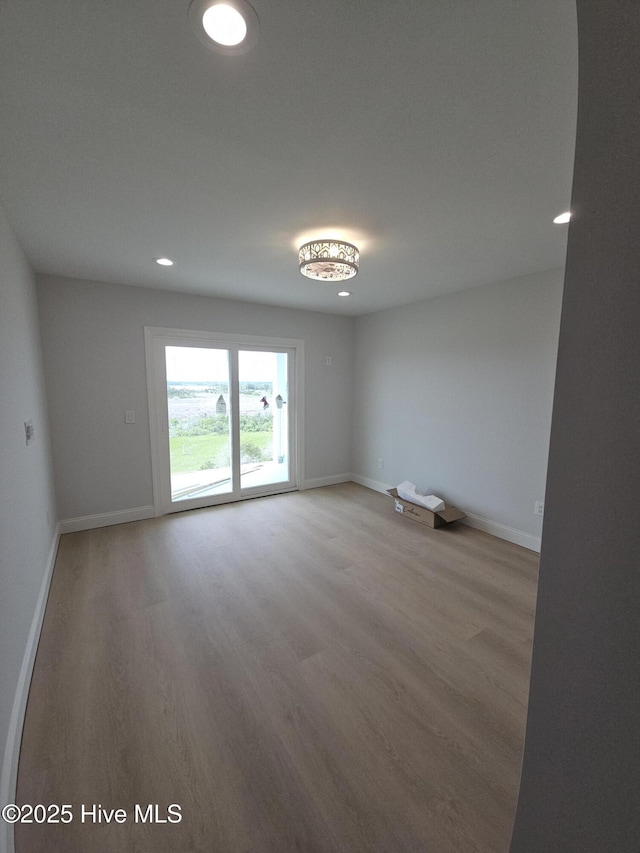 109 Old Village Ln, North Topsail Beach, NC 28460 - unfurnished room with light wood-type flooring, baseboards, and recessed lighting