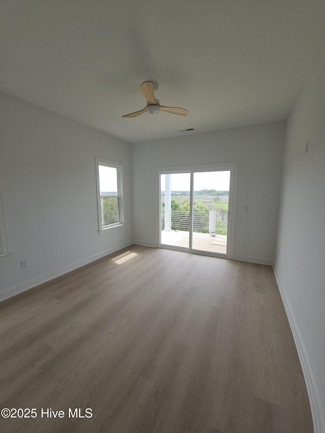 109 Old Village Ln, North Topsail Beach, NC 28460 - empty room featuring wood finished floors, ceiling fan, and baseboards