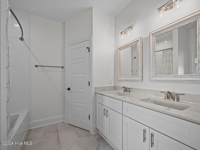 bathroom featuring shower / tub combination, a sink, baseboards, and double vanity