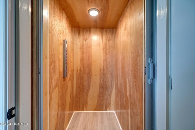 interior details with wood ceiling and elevator