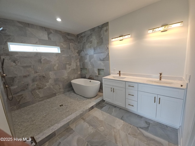 109 Old Village Ln, North Topsail Beach, NC 28460 - full bathroom featuring a freestanding tub, a walk in shower, double vanity, and recessed lighting