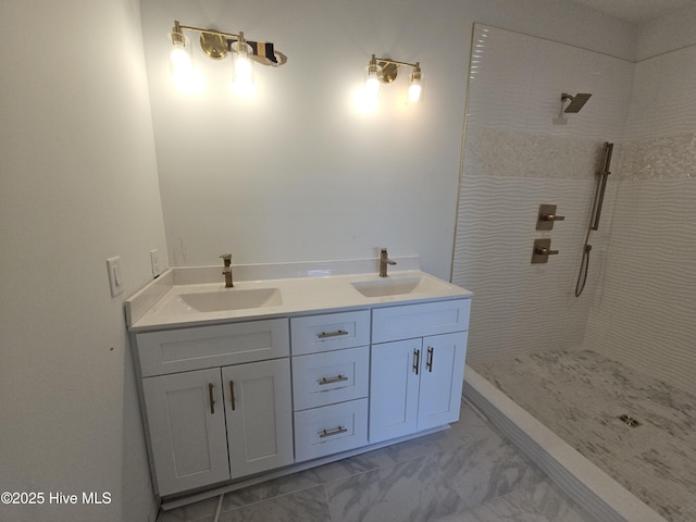109 Old Village Ln, North Topsail Beach, NC 28460 - bathroom with tiled shower, double vanity, and marble look tiles