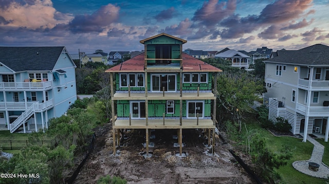 view of back house at dusk