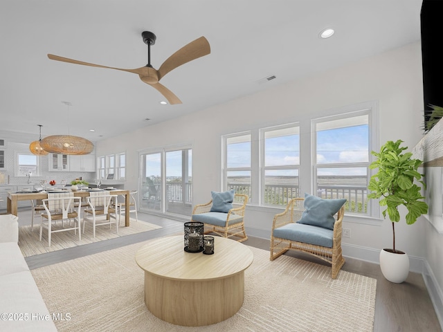 109 Old Village Ln, North Topsail Beach, NC 28460 - living area with wood finished floors, recessed lighting, a ceiling fan, and baseboards