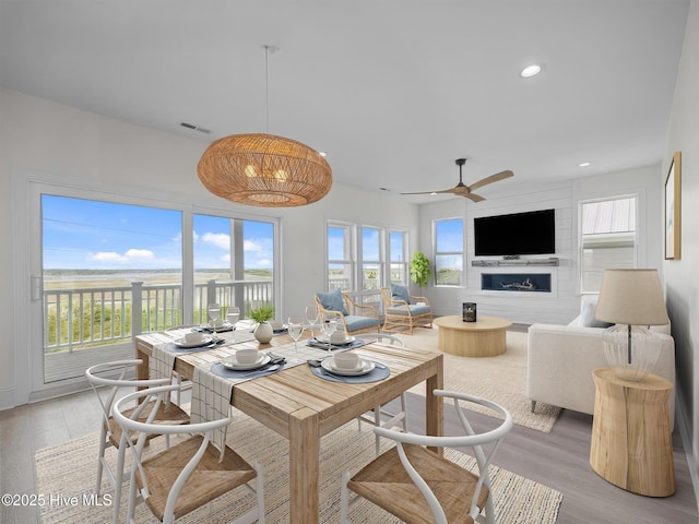109 Old Village Ln, North Topsail Beach, NC 28460 - dining area with light wood finished floors, recessed lighting, and ceiling fan