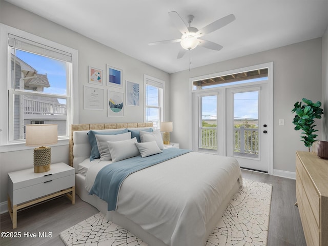 109 Old Village Ln, North Topsail Beach, NC 28460 - bedroom with light wood-style flooring, baseboards, ceiling fan, and access to outside