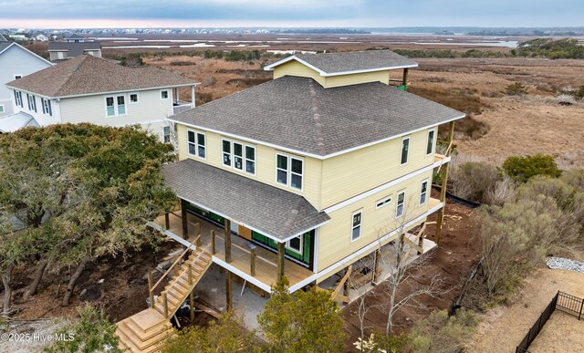 drone / aerial view featuring a water view and a residential view