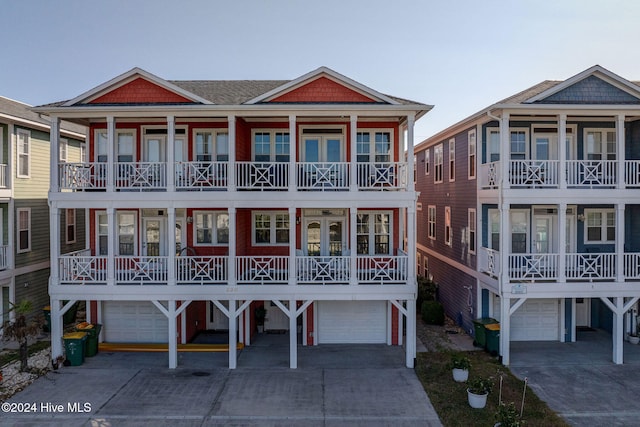 view of front of home featuring a garage and a balcony