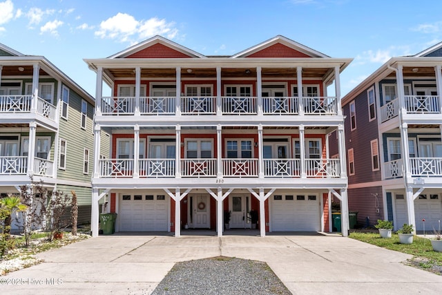 230 Third Ave Unit A, Kure Beach, NC 28449 - view of front facade featuring a garage and concrete driveway