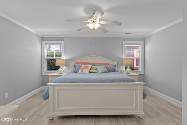230 Third Ave Unit A, Kure Beach, NC 28449 - bedroom with baseboards, light wood-type flooring, ornamental molding, and ceiling fan
