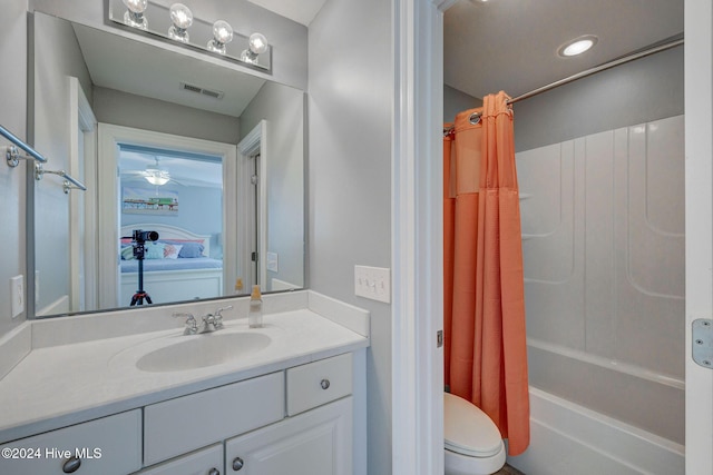 230 Third Ave Unit A, Kure Beach, NC 28449 - bathroom featuring toilet, vanity, and shower / bath combo with shower curtain