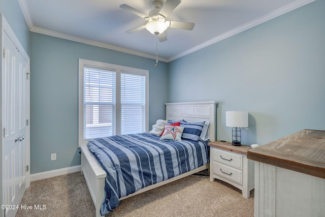 bedroom with ceiling fan, ornamental molding, a closet, and light colored carpet