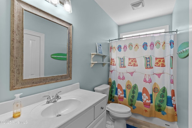 230 Third Ave Unit A, Kure Beach, NC 28449 - bathroom featuring toilet, vanity, and shower / bath combination with curtain