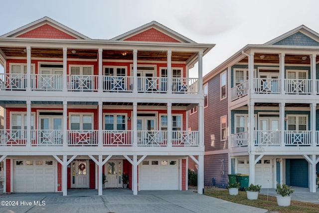 view of front facade featuring a balcony and a garage