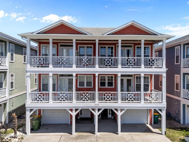 230 Third Ave Unit A, Kure Beach, NC 28449 - view of front of home with an attached garage and concrete driveway