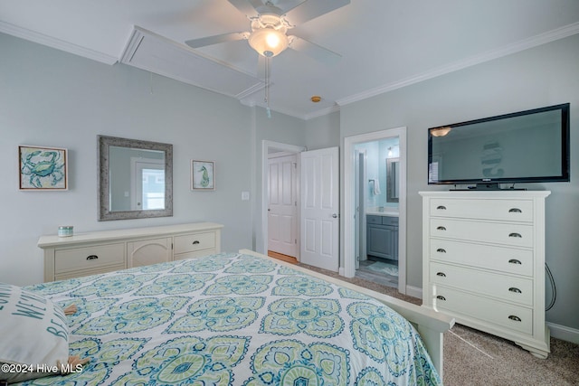 carpeted bedroom featuring crown molding, ceiling fan, and ensuite bath