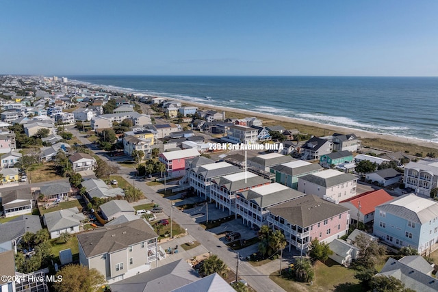 birds eye view of property with a beach view and a water view